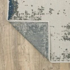 Trinity Modern Distressed Abstract Patio Area Rug Beige/Blue - Captiv8e Designs -Decora Shop GUEST 78025ae6 ad6d 4e3a a5d2 2007b50eb263