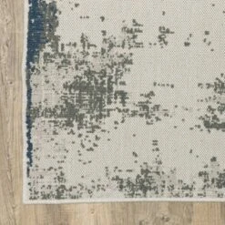 Trinity Modern Distressed Abstract Patio Area Rug Beige/Blue - Captiv8e Designs -Decora Shop GUEST f556174a 2acc 40ac b0be af804991c17b